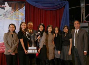 Seven students from the Iolani School, Honolulu, Hawaii, accept the trophy and Cessna Citation model for winning the Department of Energy's inaugural Real World Design Challenge.
