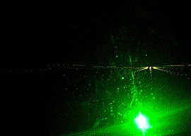 What the pilot sees: a (simulated) runway obscured by a laser flash