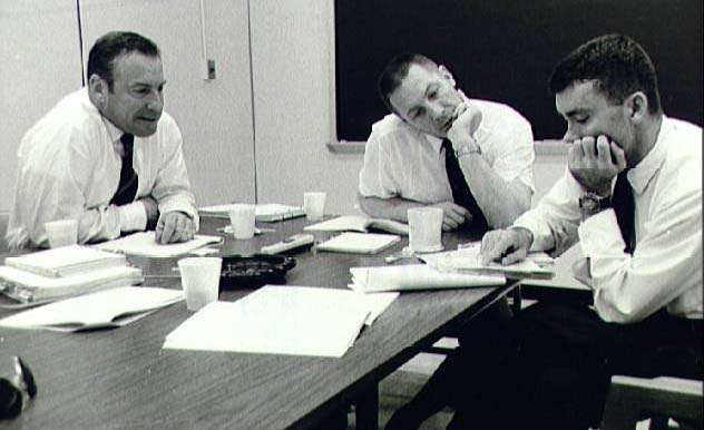 "It says, 'Subtract the amount on line 39, Form 1040, from...' " (L-R) Lovell, Swigert, Haise review data on the first day of their post-flight debriefing at the Manned Spacecraft Center in Houston, April 20, 1970. Photo: NASA